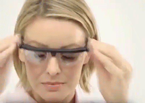 A woman using her Flex Vision glasses